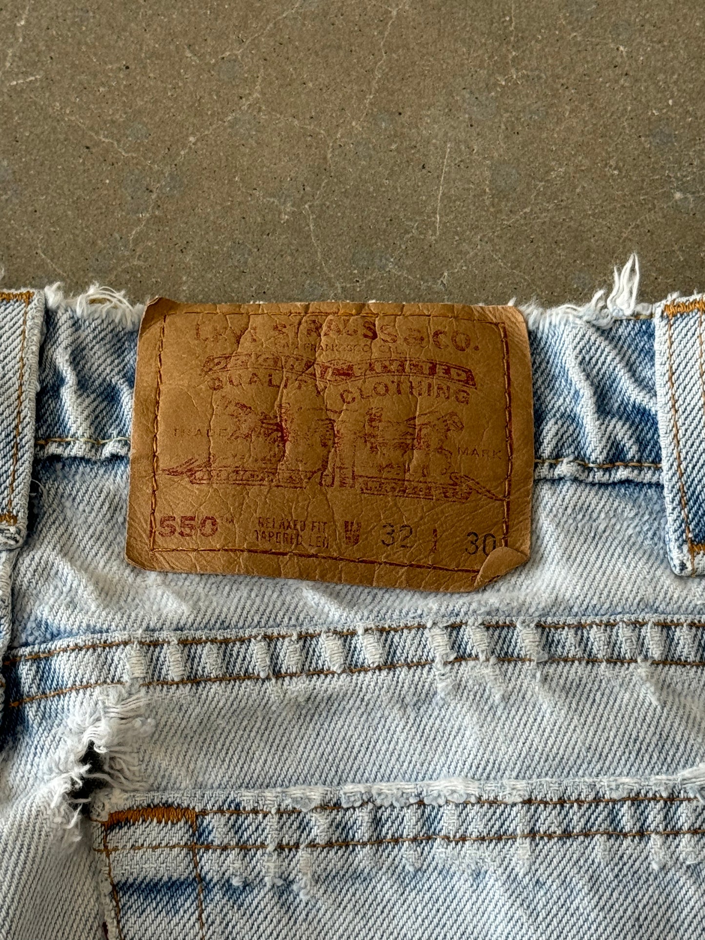 Vintage 1990s Distressed Thrashed Levis 550 Made in USA Denim Jeans [30]